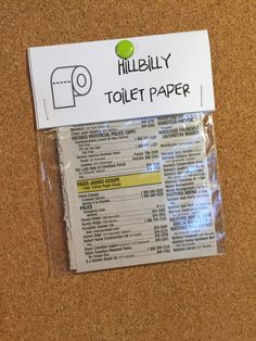 a piece of paper that is on top of a cork notice board with the words,'hillbilly toilet paper '