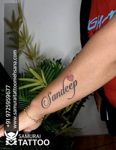 a person with a small tattoo on their arm