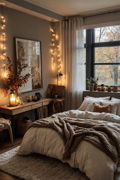 a bedroom with lights strung from the ceiling and a large bed in front of a window