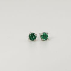 Looking for the perfect gift for a loved one or special occasion? These 14k yellow gold and emerald stud earrings are sure to impress and make an unforgettable present! Featuring stunning emeralds set in 14k yellow gold, these earrings are versatile and elegant, making them suitable for any occasion. Whether it's for a birthday, anniversary, or just a special surprise, these earrings are a timeless and luxurious gift that will be cherished for years to come. SOLD AS PAIR. Material; 14k solid gol Green Round Diamond Earrings Fine Jewelry, Classic Green Earrings For May Birthstone, Green Brilliant Cut Round Diamond Earrings, Green Diamond Earrings With Brilliant Cut, Formal Green Diamond Cut Earrings, Round Cut Emerald Earrings For Anniversary, Emerald Round Cut Earrings For Anniversary, Emerald Round Cut Fine Earrings, Green Diamond Earrings For Wedding With Prong Setting