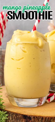 mango pineapple smoothie in a glass with a red and white striped straw on top