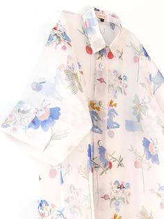 "Minimal Sophia oversized shirt dress has an A-line fit and features daisy mother of pearl shell buttons. The exclusive print is from a collaboration with artist Estée Preda and features a playful and joyful illustration. Ariam is 5'8\" has a 32\" bust and wears a size One size. Sent to you lovingly hand wrapped. If you have any questions before placing your order, kindly send me a message, I'm here to help! Fit * Oversized fit * Maxi length * Enclosed French seams * Wide elbow length sleeves Fa White Floral Print Short Sleeve Shirt Dress, Spring Oversized Shirt Dress For Brunch, Oversized Shirt Dress For Spring Brunch, Oversized White Shirt Dress For Spring, Summer Floral Print Collared Shirt Dress, Collared Floral Print Shirt Dress For Summer, Spring Printed Shirt Dress For Daywear, White Button-up Shirt Dress With Floral Print, Short Sleeve Printed Shirt Dress For Spring