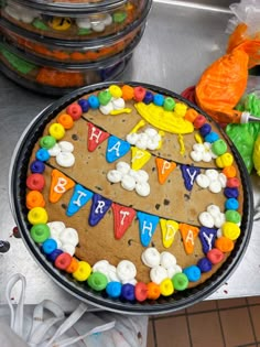 a birthday cake is decorated with colorful icing