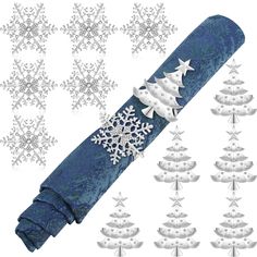 snowflakes and christmas trees are on the blue fabric with silver trimmings