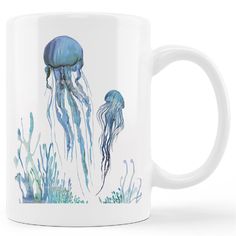 a coffee mug with an image of two jellyfishs on the bottom and one in the middle