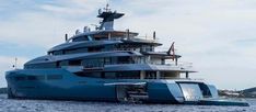 a large blue boat floating on top of the ocean