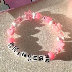 every princess needs this bracelet in their life 👑💗 details ❥ approximately 6.5 inches & super stretchy 🐛 ❥ can be adjusted to your sizing :) 🌈 ❥ want this same design but want it to say something else? i can do that ⚡️ Disney Kandi Bracelets, Cartoon Bracelet Ideas, Rave Candy Bracelets Ideas, Kandi Bracelets Tutorial, Bracelet Sayings, Kandi Bracelets Ideas, Bracelets Kandi, Princess Bracelet, Bracelet Y2k