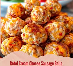 a pile of cheese balls sitting on top of a plate with the words, roti cream cheese sausage balls