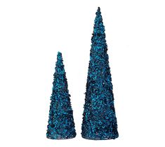 two small blue trees sitting next to each other