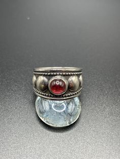 "Vintage James Avery Garnet ring.  Size Sterling Silver.  This is an estate piece and was not polished to protec the patina.  It can be cleaned if you prefer the \"shiny\" silver, but the patena will return with wear as this is sterling silver.  Very little wear, client estimated purchased in 1980s. It can be sized for an additional fee, just message me for details.  Please ask questions before you buy.  We reply promptly." Silver Open Ruby Ring Stamped 925, Silver Ruby Open Ring Stamped 925, Classic Silver Ruby Ring Stamped 925, Unique Silver Ruby Ring With Polished Finish, Vintage Ruby Ring Stamped 925, Heirloom Silver Ruby Ring With Polished Finish, Silver Ruby Open Ring Hallmarked, Silver Heirloom Dome Ring, Round Shape, Heirloom Silver Dome Ring