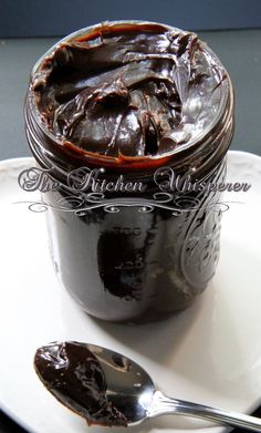 chocolate spread in a jar on a plate with a spoon