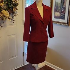 B Smart Dark Red/Wine Stretch Suede-Like Fabric 2 Piece Skirt Set. Jacket And Pencil Skirt. Jacket Has Notched Collar. 3 Covered Button Closure. 3/4 Sleeve Fitted. Lightly Padded Shoulders. Skirt Has Back Zipper. 14" Across Waist 18" Across Hips 19" Long. Size 3/4. 97% Polyester 3% Spandex. Washable. New With Tags. Tailored Red Long Sleeve Skirt Suit, Classic Red Skirt Suit For Work, Fall Formal Red Skirt Suit, Fitted Burgundy Blazer With Pockets, Red Long-sleeve Skirt Suit For Office, Red Long Sleeve Skirt Suit For Work, Red Skirt Suit For Spring Workwear, Red Fitted Long Sleeve Skirt Suit, Fitted Red Skirt Suit With Long Sleeves