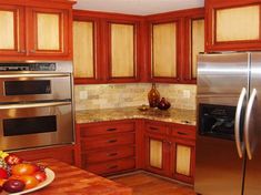 a kitchen with stainless steel appliances and wooden cabinets