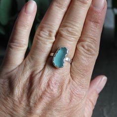 Do you need a gift for someone who is hard to buy for? Or for someone who has everything? Sea glass jewelry is always a great gift to give! Here are the details about this ring:This ring has a piece of turquoise blue sea glass that is set in a sterling silver scalloped bezel and soldered to a sturdy sterling silver pattern band. It is simple and will remind you of the beach! All of our sea glass is found and never altered in any way. This piece was handmade by Barb Macy in Corvallis, OR. Size 8 Turquoise Recycled Glass Jewelry For Crafting, Nickel Free Turquoise Ring For Gift, Nickel Free Turquoise Ring As A Gift, Turquoise Recycled Glass Jewelry For Jewelry Making, Sterling Silver Blue Turquoise Ring Gift, Handmade Turquoise Aquamarine Ring, Blue Recycled Glass Jewelry For Gift, Blue Recycled Glass Jewelry As Gift, Ocean-inspired Blue Ring For Gift