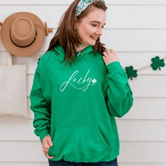 St. Patrick's Day won't be half the fun without this unique Irish green party shirt. This authentic Irish green Irish hooded sweatshirt is perfect for your festivities. This comfortable green Irish hoodie (available in multiple unisex shirt sizes and colors, including Irish green), will keep you warm and make you the toast of your shamrock and clover St. Paddy's Day party and parade. Celebrate the Luck of the Irish with your friends, a cold pint or two and your new Print Boutique gear. Sláinte! *All Print Boutique merchandise is designed by an independent artist born and raised in Chicago. We know you'll enjoy.* THE SWEATSHIRT ▶ This unisex heavy blend hooded sweatshirt is relaxation itself. Made with a thick blend of cotton and polyester, it feels plush, soft and warm. It's the perfect ch Green Letter Print Hoodie, Green Casual Pre-shrunk Hoodie, Casual Green Pre-shrunk Hoodie, Green Pre-shrunk Hoodie With Crew Neck, Green Pre-shrunk Crew Neck Hoodie, Green Hoodie Sweatshirt With Letter Print, Green Letter Print Hoodie Sweatshirt, Paddys Day, Lucky Clover