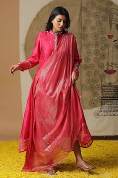 Coral draped dress with hand painted flower on cuffs and placement hand embroidery. Comes with an attached stripe texture drape. - Aza Fashions Festive Traditional Dress With Embroidered Hem, Festive Traditional Embroidered Dress With Hem Detail, Red Dress With Dupatta For Spring, Traditional Drape Dress With Dupatta For Spring, Silk Dress With Zari Work For Spring, Spring Silk Dress With Zari Work, Silk Dresses With Sheer Dupatta For Transitional Season, Festive Wedding Dress With Embroidered Hem, Red Silk Straight Kurta Dress