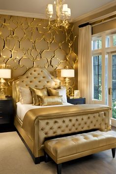 a large bed sitting in a bedroom next to a window with gold paint on it