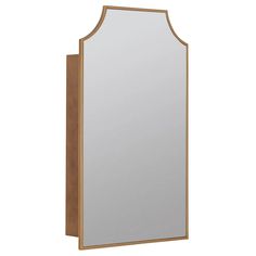 a mirror that is sitting on top of a wooden shelf with a light brown frame