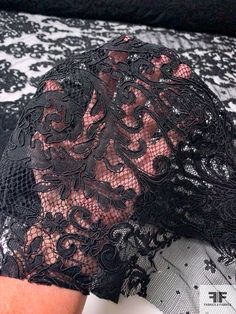 This black Victorian design corded lace designer fashion fabric will take you back to the era of corsets, bonnets, top hats, bustles and petticoats. SKU: 12368 Content: Polyester Color: Black Width: 57 inches Black Lace With Lace Closure For Evening, Fitted Lace Patchwork For Party, Stretch Lace With Lace Patchwork For Party, Party Black Lace With Contrast Detail, Black Fitted Lace For Wedding, Fitted Black Lace For Wedding, Black Lace With Patchwork For Evening, Fitted Black Lace With Lace Trim, Fitted Victorian Lace With Lace Trim