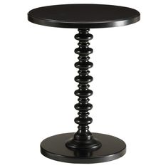 a round table with black wood top and metal base on an isolated white background photo