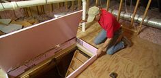 a man in red shirt working on wooden floor