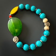 The Green Agate Summer Vibe Bracelet is a stunning accessory that exudes a sense of energy and vitality. The Green Agate stone is said to promote balance and harmony, while the other stones and beads are thought to have their own unique energy properties as well.The bracelet also features a vibrant yellow African bead, which is said to symbolize happiness and prosperity. Together, these elements create a beautiful and vibrant piece that is perfect for adding a touch of color to any summer outfit Jade Bracelets With Natural Stones For Meditation, Agate Natural Stone Bracelets For Meditation, Agate Bracelets With Natural Stones For Meditation, Agate Healing Bracelet For Meditation, Holistic Agate Bracelet For Meditation, Handmade Jade Bracelets For Meditation, Holistic Turquoise Beaded Bracelets With Natural Stones, Agate Bracelets With Polished Beads For Meditation, Spiritual Agate Beaded Bracelet With Polished Beads