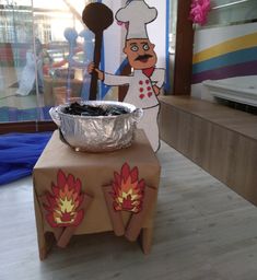 an image of a man cooking food on a table in the middle of a room