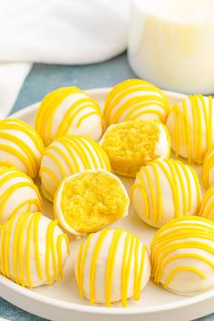 a white plate topped with yellow and white striped cookies