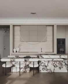 a kitchen with marble counter tops and white chairs