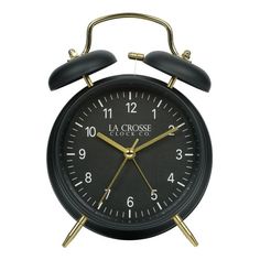 a black and gold alarm clock on a white background with the words la crosse