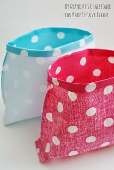 two small polka dot baskets sitting on top of each other, one is pink and the other is blue