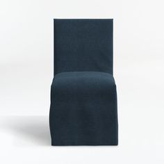 a blue chair sitting on top of a white floor next to a black object in the background