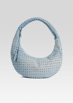 Introducing our Elodie Large Bag, the ultimate accessory that combines chic and edgy. Crafted with precision and adorned with stylish studded embellishments, this denim shoulder bag is designed to make a statement. Elevate your style and carry your essentials in luxury. Shown here in Chambray/Silver. 100% Cotton Style Chic Studded Shoulder Bag, Trendy Everyday Bags With Rivets, Chic Shoulder Bag With Rivets For Everyday Use, Chic Everyday Shoulder Bag With Rivets, Trendy Shoulder Bag With Rivets For Daily Use, Everyday Studded Bags, Trendy Hobo Tote Bag With Metal Hardware, Trendy Leather Bags With Hardware, Trendy Tote Shoulder Bag With Gunmetal Hardware