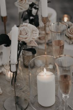 the table is set with candles and flowers