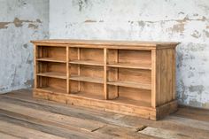 an old wooden bookcase on the floor