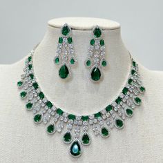 Emerald CZ diamond bridal necklace, American Diamond wedding necklace, Cz jewelry, Indian, Pakistani, and Punjabi wedding jewelry  Regular Size And Adjustable with rhodium finish Ships from California, USA Delivery in 2-5 business days in the USA. Other colors can be found here https://www.etsy.com/listing/1423096838/ruby-cz-diamond-bridal-necklace-american?ref=listings_manager_grid https://www.etsy.com/listing/1423097794/sapphire-cz-diamond-bridal-necklace?ref=listings_manager_grid Color, shade Wedding Diamond Necklace With Jewels In Cubic Zirconia, Wedding Diamond Necklace With Cubic Zirconia, Wedding Cubic Zirconia Diamond Necklace, Emerald Necklace With Diamond Cut For Wedding, Cubic Zirconia Emerald Necklace For Wedding, Brilliant Cut Emerald Necklace For Wedding, Dazzling Round Emerald Necklace For Wedding, Dazzling Emerald Necklace For Wedding, Wedding Emerald Necklace With Diamond Accents