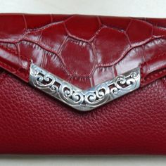 Brighton Mingle Small Red Croc Leather Envelope Wallet Crossbody Nwt Wallet Crossbody Width: 6 1/4" Height: 4" Depth: 1/2" Exterior Material: Leather Back Slip In Pocket Snap Closure Small Slip In Pocket Under Snap Zip Pocket Inside Middle 2 Slip In Pockets - One With Id Holder Adjustable Crossbody Strap Msrp $95 Loc E & P Elegant Red Wallets With Card Slots, Elegant Burgundy Bifold Wallet, Elegant Red Bifold Coin Purse, Leather Envelope, Envelope Wallet, Croc Leather, Id Holder, Crossbody Strap, Brighton