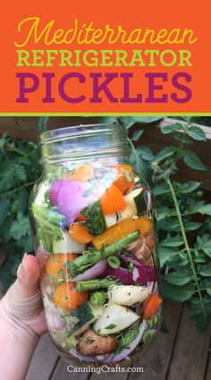 a mason jar filled with different types of veggies and the words mediterranean refrigerator pickles