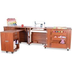 an office desk with sewing machine and crafting supplies on it's drawers,