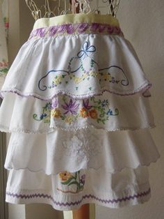 a white skirt with purple and yellow flowers on it