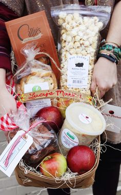 a person holding a basket full of food