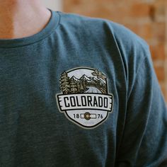 A longsleeve version of our best selling Woodland t-shirt, this Colorado longsleeve t-shirt is an awesome combination of organic outdoor colors and ColoradoCool's bold design style. Features a sweet outdoor Colorado landscape, big "COLORADO" text, Colorado's established date and a nice subtle topo map in the background. The smaller design on the front is perfect for those who like to put into practice a little bit of that "mullet approach", business in the front and party in the back. Snag this Colorado Tshirt, Colorado Shirt, Colorado Outfits, Colorado Landscape, State Of Colorado, Topo Map, Bold Design, Outdoor Apparel, Small Designs