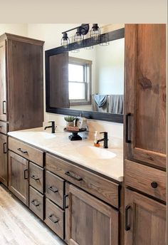 a bathroom with wooden cabinets and white counter tops