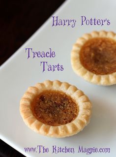 two small pies on a white plate with the words harry potter's treacle tarts