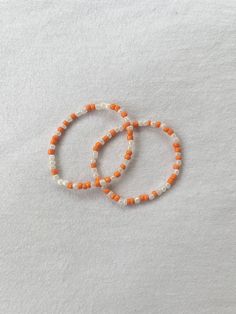 This bracelet is perfect for fall and is handmade! Handmade Orange Stretch Bracelet, Handmade Orange Beaded Bracelets As Gift, Handmade Orange Beaded Bracelets For Gift, Handmade Orange Beaded Bangle Bracelets, Handmade Orange Casual Friendship Bracelet, Casual Handmade Orange Friendship Bracelets, Casual Handmade Orange Friendship Bracelet, Casual Orange Wristband For Gift, Casual Orange Wristband As Gift