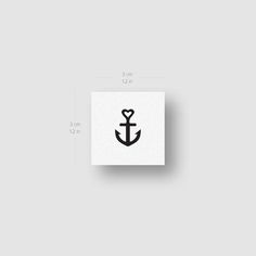 an anchor sticker is shown on the side of a white square paper with black ink