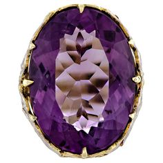 Exquisite antique amethyst and two-colored gold ring - centrally set with one large oval-shaped brilliant-cut rich deep colored purple amethyst measuring approximately 23.1mm x 18mm set into a lovely two-colored gold yellow and white - 14kt frame - elaborate foliate design. Ring Size: 6.5 Measurements: Amethyst: Approximately 23.1mm Length x 18mm Width Condition: Very Good Period: Circa 1890 Style: Victorian Amethyst Gold, Amethyst Jewelry, Deep Colors, 14kt Gold, Purple Amethyst, Gold Yellow, Cocktail Rings, Kitsch, Gold Ring