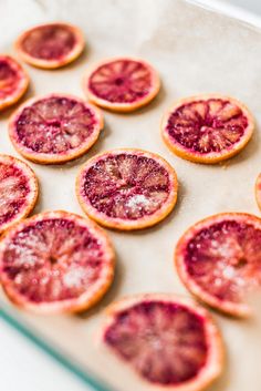 blood oranges are arranged on a baking sheet