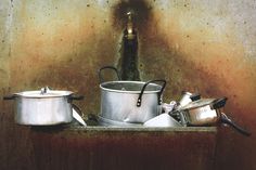 pots and pans sitting on top of a counter