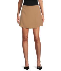 From Gianni Bini&#x2C; this skirt features:Faux wrap silhouetteMini lengthStretch suitingInvisible back hook and zip closureApprox. 15.25" in lengthPolyester/rayon/elastaneDry cleanImported. Asymmetrical Skirt With Side Zipper For Work, Workwear Asymmetrical Skirt With Side Zipper, Chic Workwear Mini Skirt With Side Zipper, Workwear Mini Skort With Side Zipper, Spring Workwear Skirt With Side Zipper, Chic Short Wrap Skirt For Work, Short Skirt With Side Zipper For Work, Mini Wrap Skirt For Fall Workwear, Workwear Mini Wrap Skirt For Fall